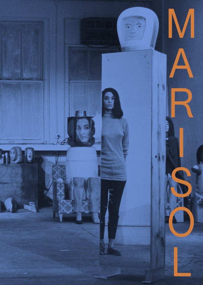 Blue book cover of a photo of a woman in a room with her sculptures with the word "Marisol" on the right side in orange font